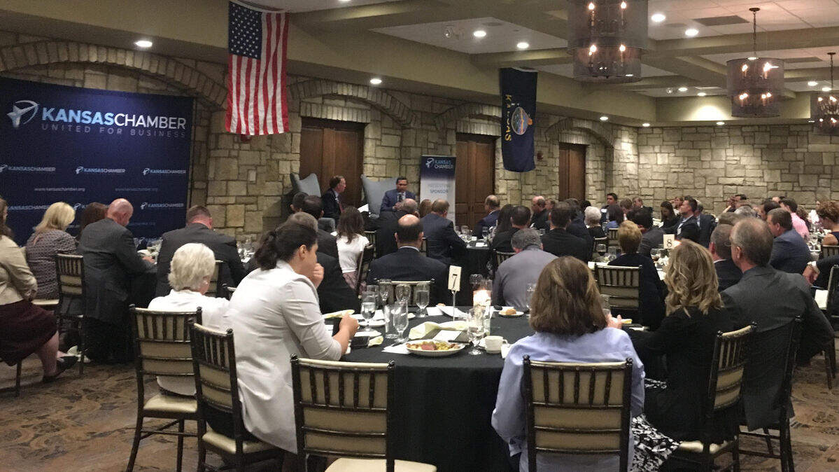 Independent candidate for governor Greg Orman speaks with Kansas Chamber President and CEO Alan Cobb during a question and answer session Monday.