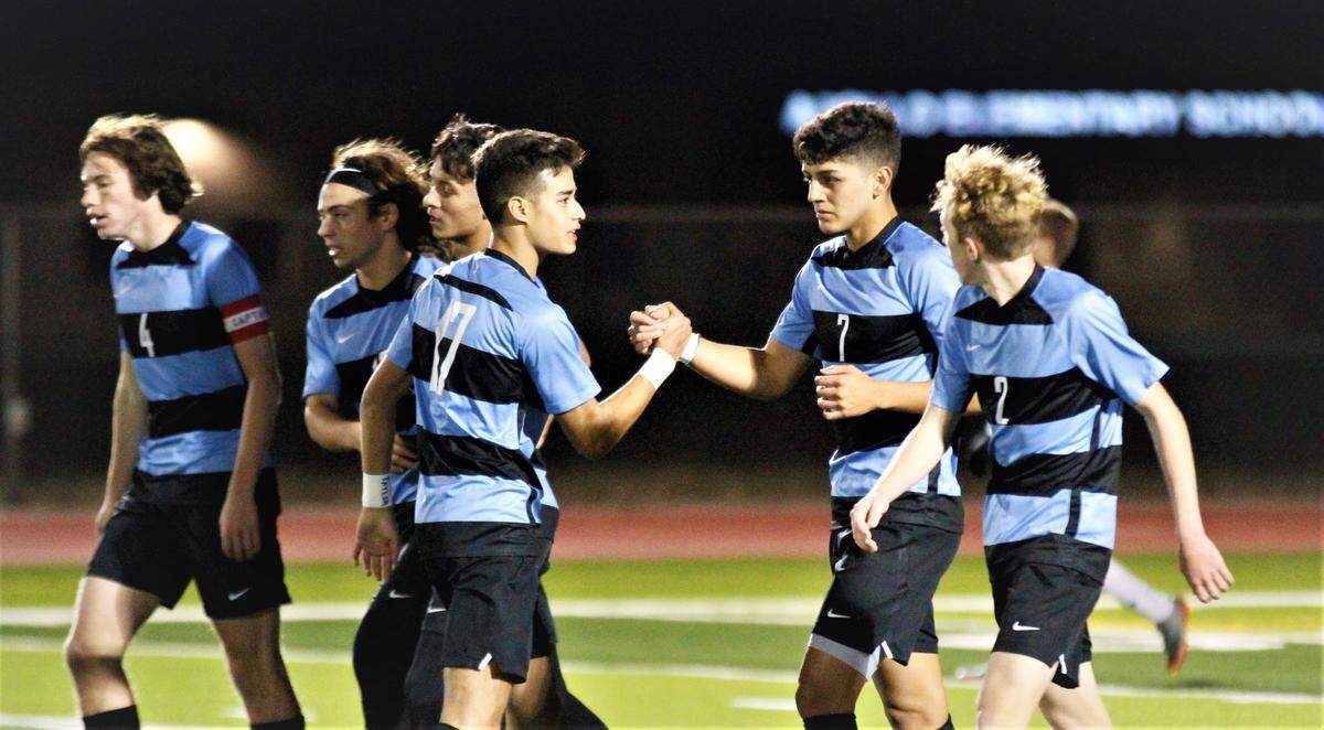 Eisenhower boys soccer celebrates a goal vs. Maize South