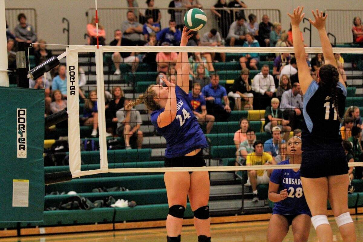 Kapaun sophomore outside hitter Evan Dalian spikes the ball during the Crusaders’ triangular with Bishop Carroll and Wichita East on Tuesday. (Sept. 4, 2018)