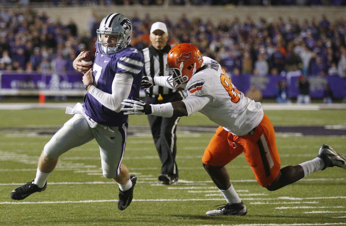 Kansas State Wildcats quarterback Collin Klein, left, scrambles during a game against Oklahoma State on Nov. 3, 2012.