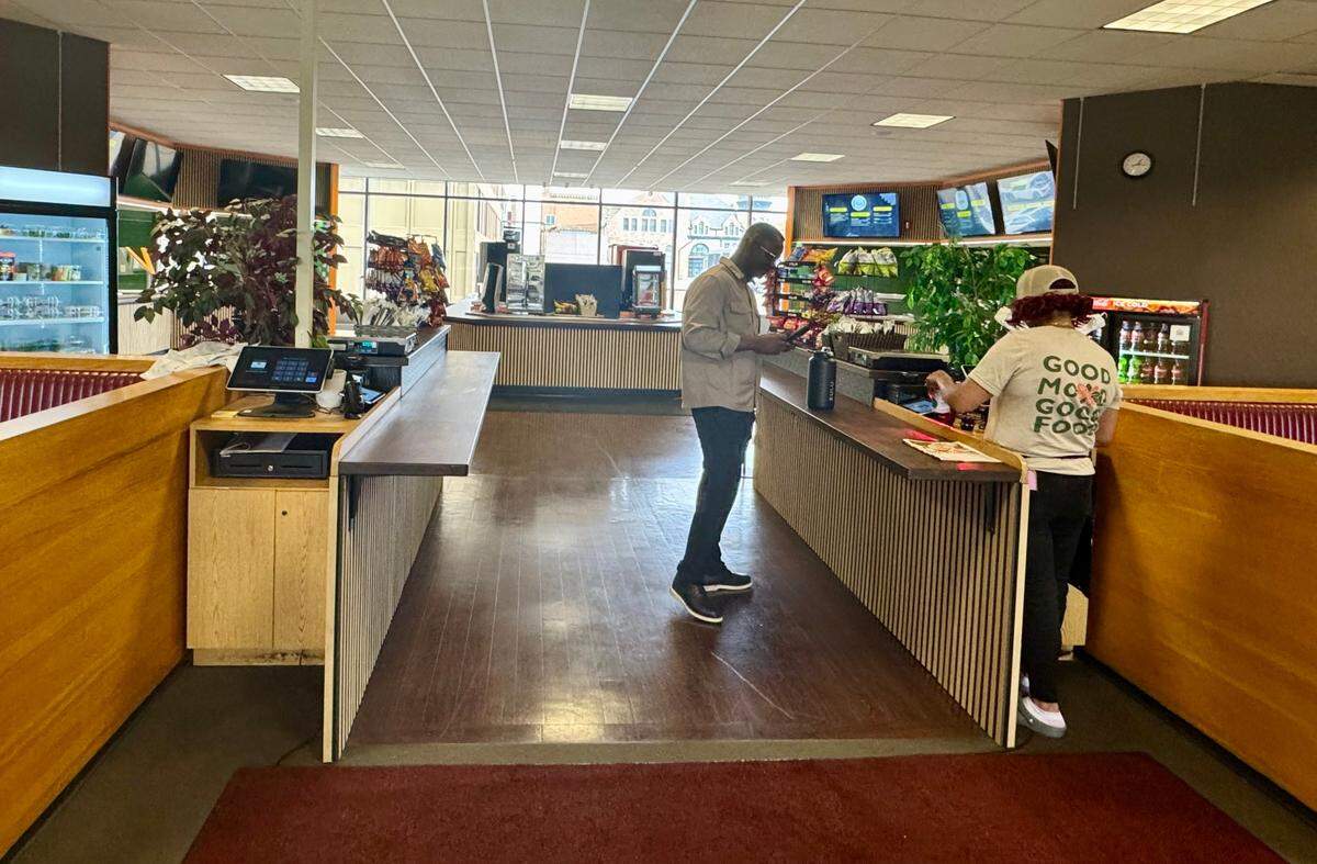Customers at the new Plentibloom Market & Cafe make their selections them pay on their way out.