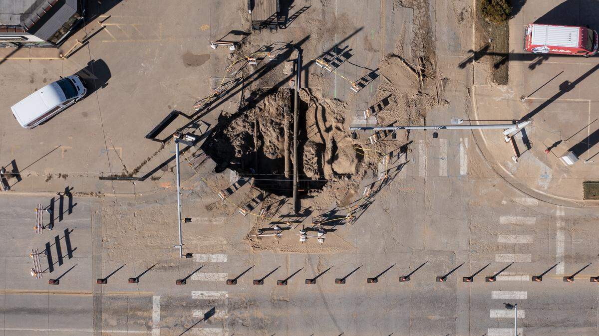 The sinkhole that developed after a large water main break at the intersection of Central and Washington.