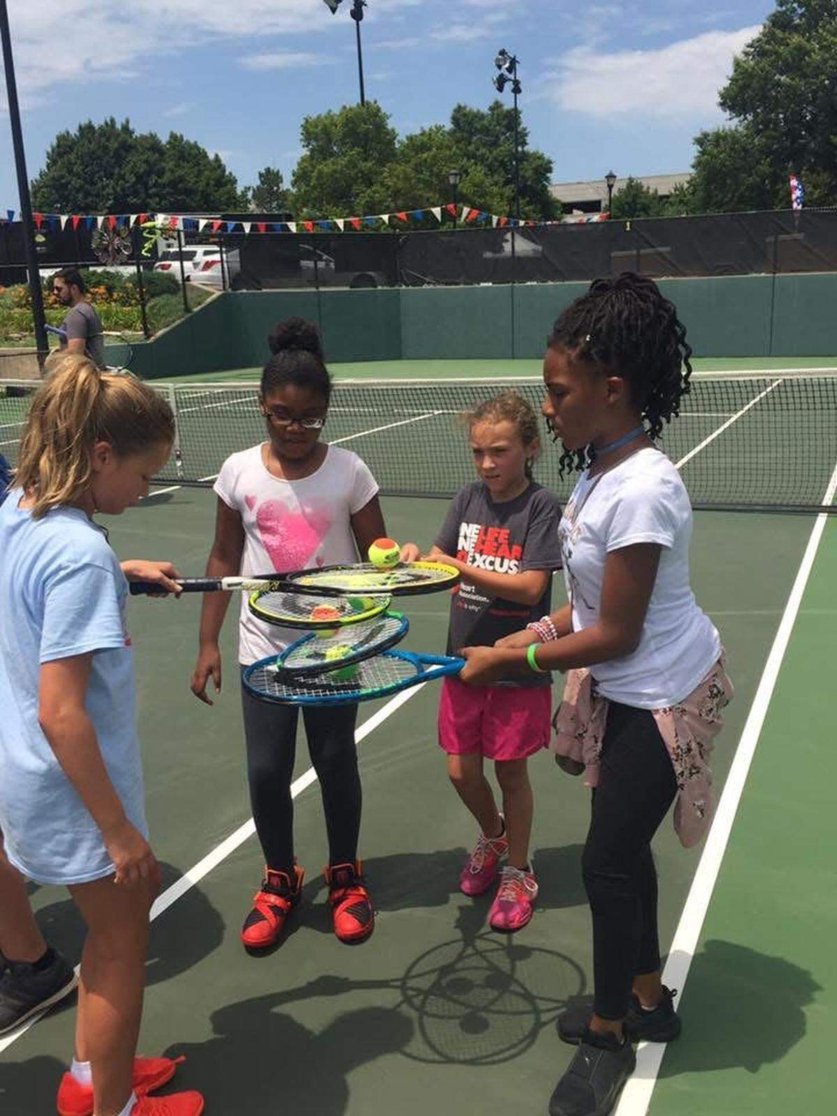 Local children enjoy free tennis lessons made available during the 2-week stay of the Wichita Tennis Open at the Sheldon Coleman Tennis Complex on Wichita State’s campus.