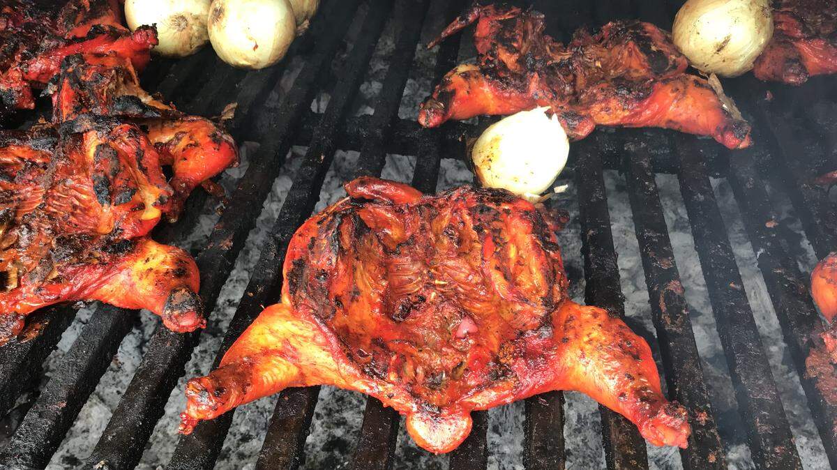 The chicken from El Pollo Dorado gets its orange hue from achiote and is made smoky with mesquite charcoal.