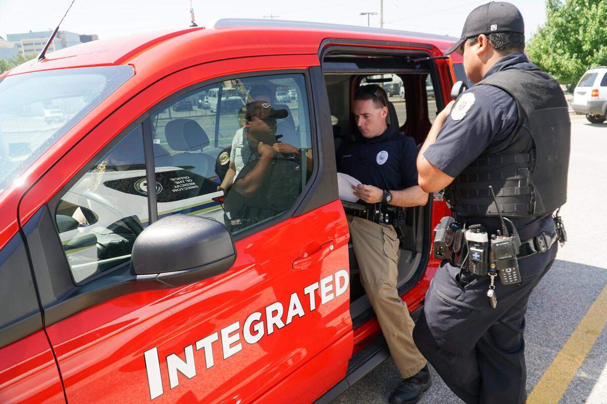 Sedgwick County Sheriff’s Deputy Kyle Broussard looks over paperwork inside the Integrated Care Team vehicle. Integrated Care Team is a 90-day pilot program that includes people with city and county groups. These people will travel together in this vehicle to asses people’s needs which could involve mental and substance abuse treatment. (July 26, 2019)
