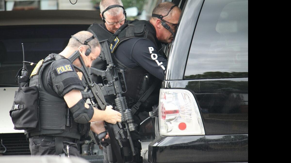 Police SWAT members outside a south Wichita apartment complex.