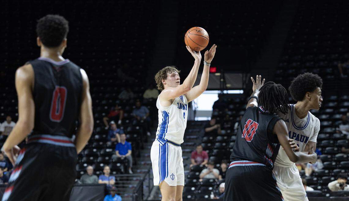 Kapaun’s Rocco Keller takes shot during the second half against Shawnee Heights on Tuesday at the quarterfinals of the 6A basketball tournament at Koch Arena.