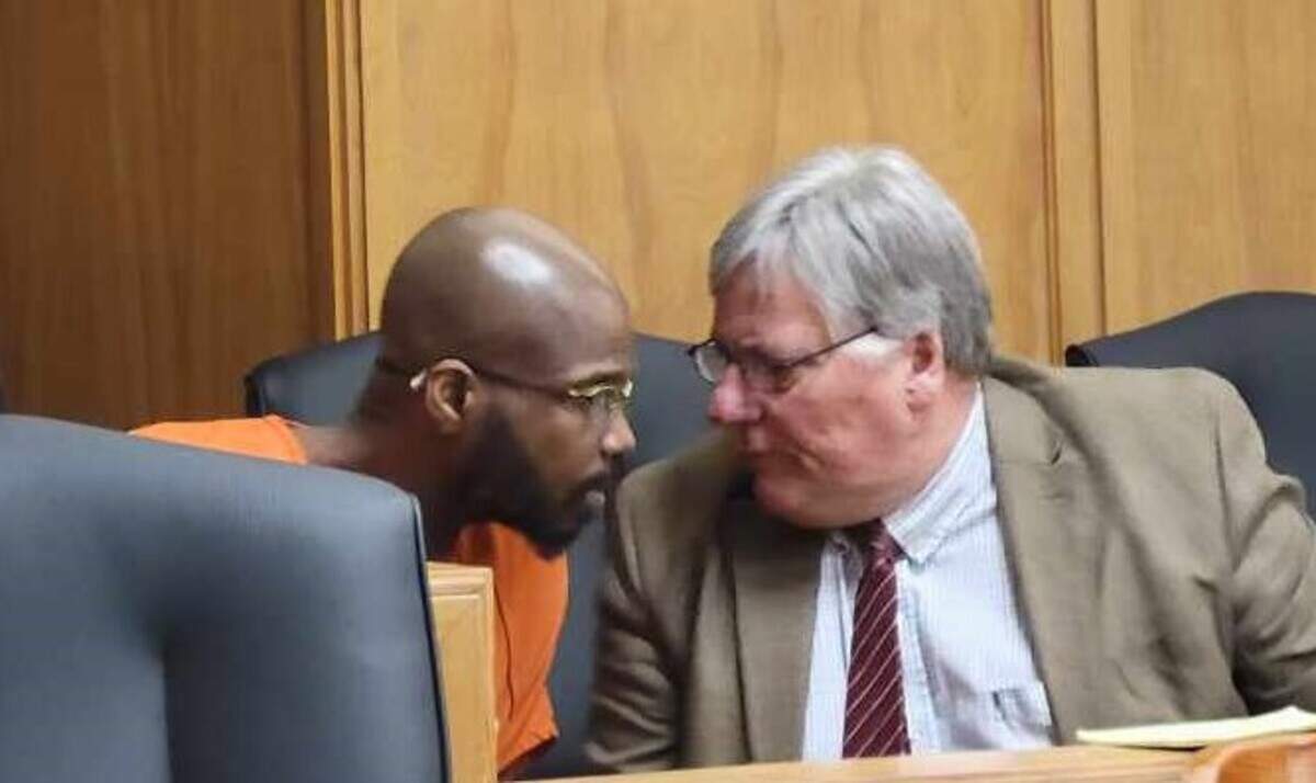 Laroy Monzell West talks with his attorney before being sentenced Friday to more than 50 years in prison for the killing of 39-year-old Will Robinson, who was shot while working security at QuikTrip in downtown Wichita.