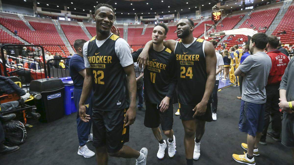 Wichita State's Markis McDuffie, Landry Shamet and Shaq Morris walk off the court after practice Thursday in San Diego.