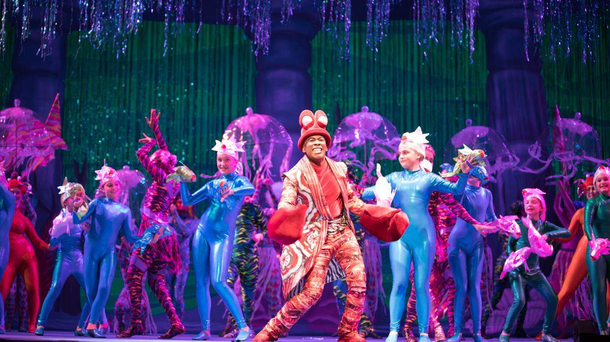 Sebastian the Crab (Lawrence Cummings) leads the company in “Under the Sea,” directed and choreographed by Linda Goorich for the Music Theatre Wichita production of Disney’s “The Little Mermaid,” playing August 8-18 at Century II.