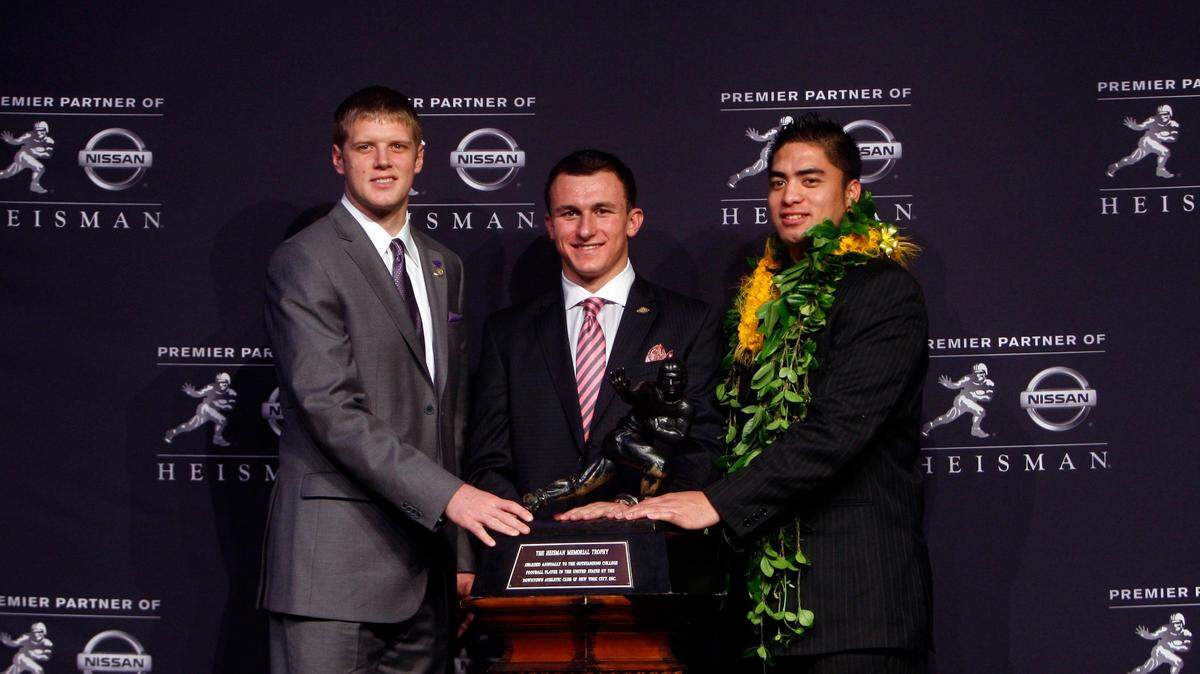 Collin Klein, Johnny Manziel and Manti Te’o pose with the Heisman Trophy in New York on Dec. 8, 2012.