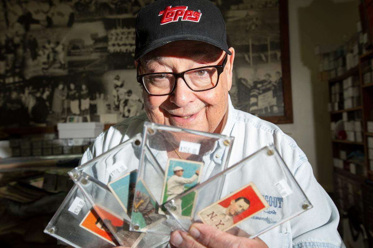 Rock’s Dugout owner Joe Ruocco was surprised to recently have four 1909 baseball cards returned to him by a man who explained he’d taken them from the shop when he was 12. “It took a lot of guts,” Ruocco said. (April 28, 2022)