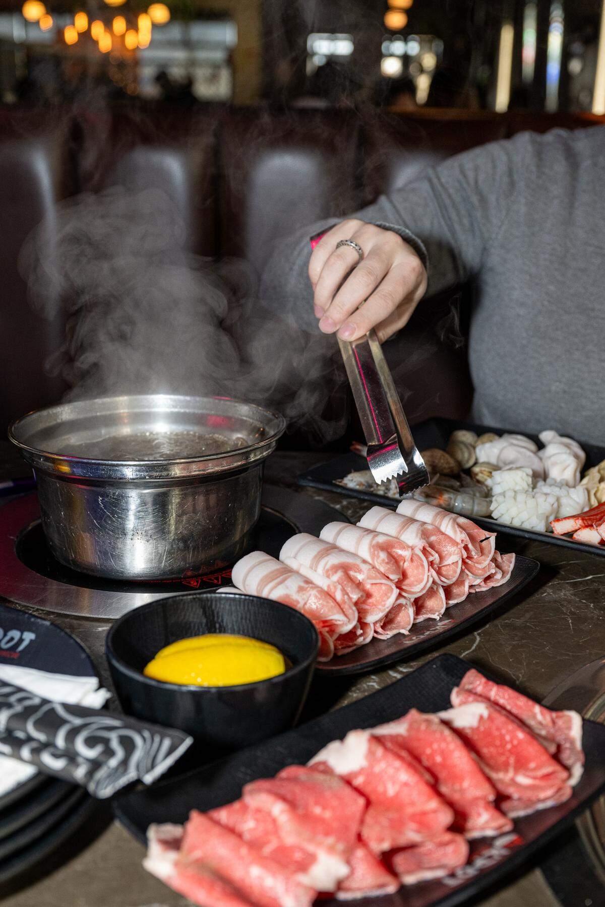 Customers construct and cook their own food at the new KPOT restaurant, which will serve Korean bbq and hot pot.