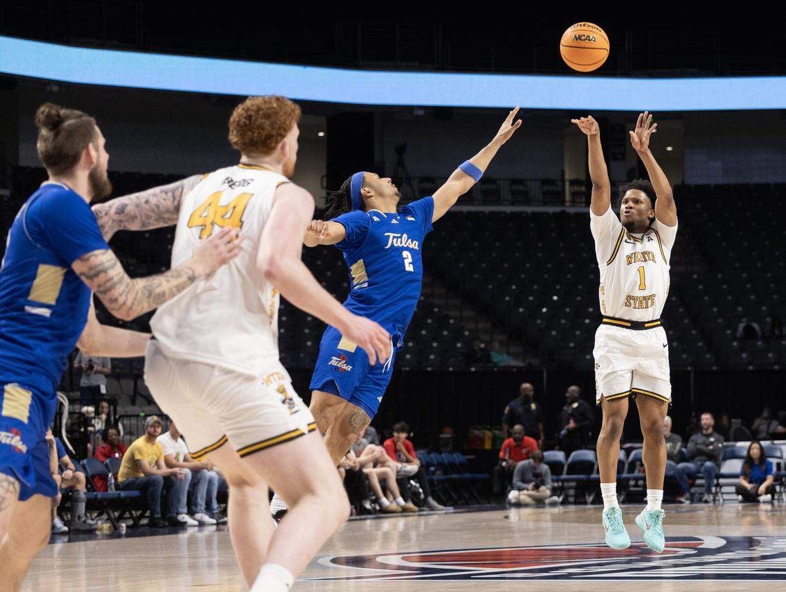 Wichita State’s Kenyon Giles hits a three-pointer over Tulsa defender Jaylen Lawal during the first half of their AAC tournament semifinal game on Saturday in Birmingham.