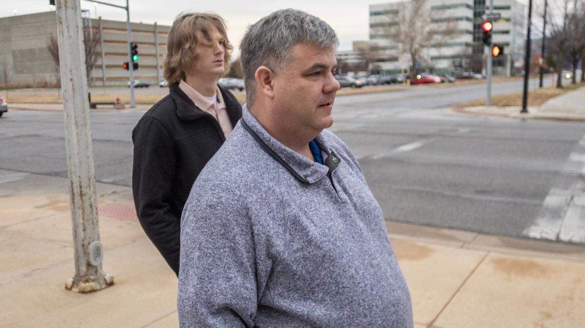 Former state legislator Michael Capps, right, along with his son Chaz, arrives for his trial at the federal courthouse in downtown Wichita on Monday morning. Capps is standing trial on 18 federal charges of COVID-19 relief fraud — including submitting false statements, wire fraud and money laundering — related to more than $450,000 in CARES Act money.