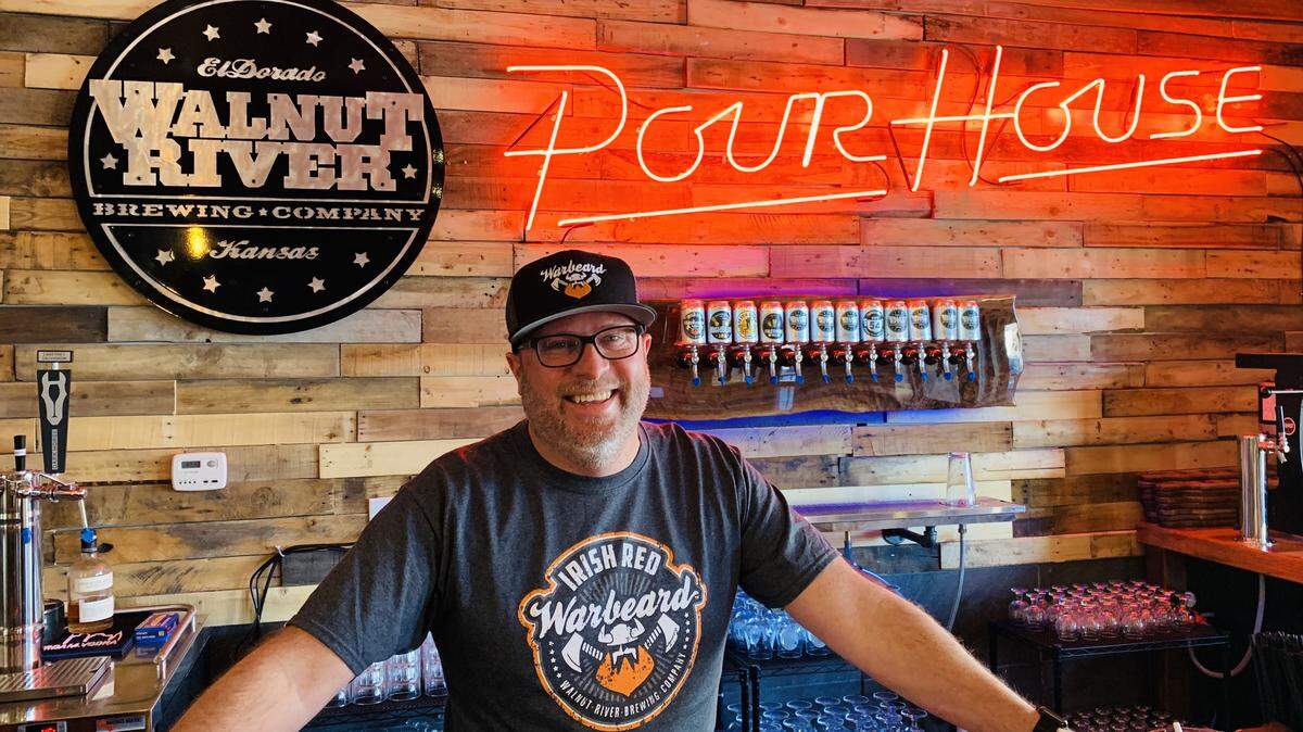 Pour House general manager Darrin Hackney behind the new bar, which is fitted with a “Road House”-inspired neon sign