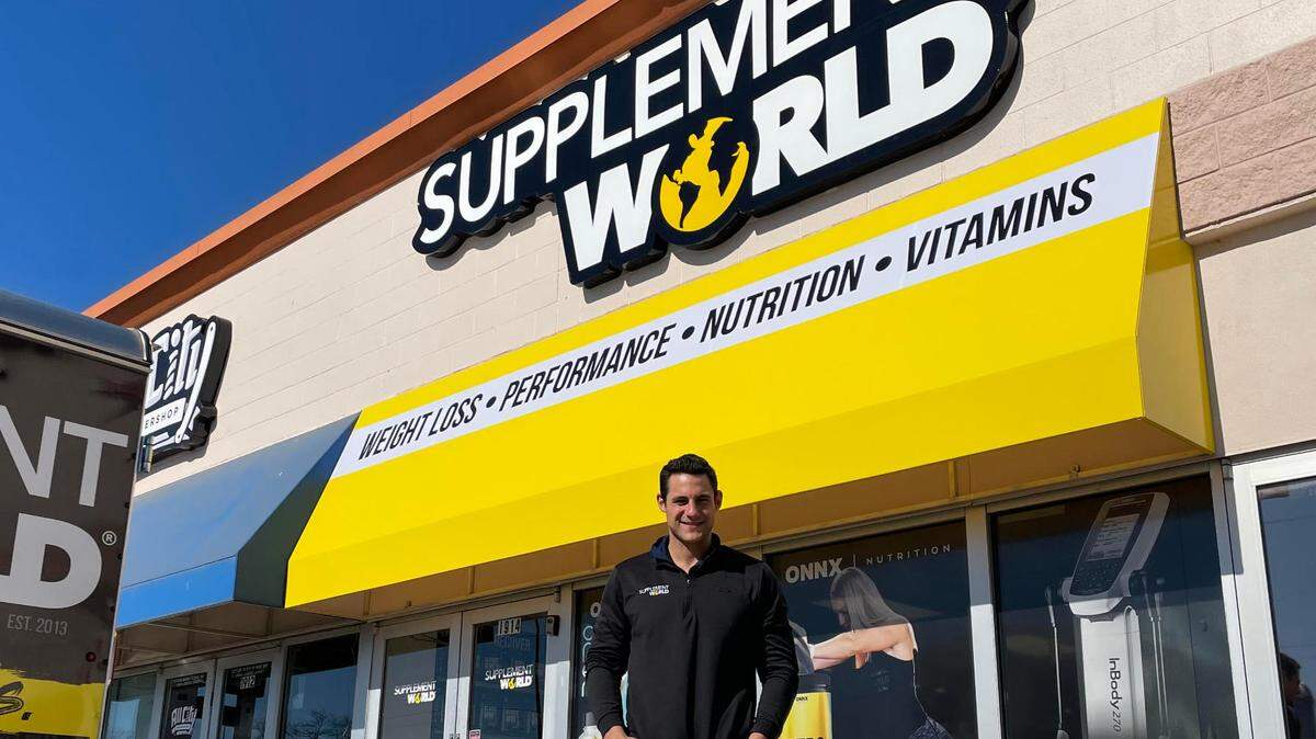 Dustin West stands in front of the Supplement World that he and Jeff McAnarney are opening near 21st and Amidon on Friday.
