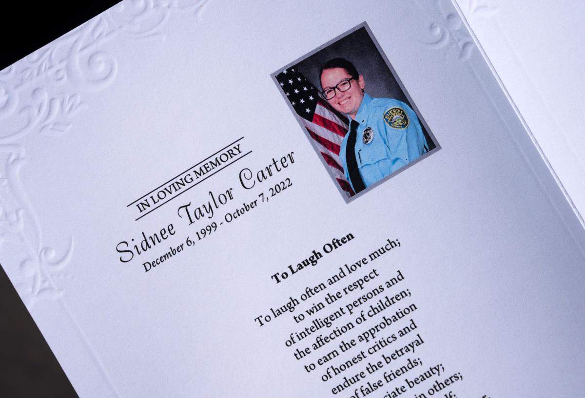A funeral program for Sedgwick County deputy Sidnee Carter. Carter, 22, died Oct. 7 while responding to a disturbance call when her patrol vehicle collided with another vehicle at 135th Street West and 29th Street North.