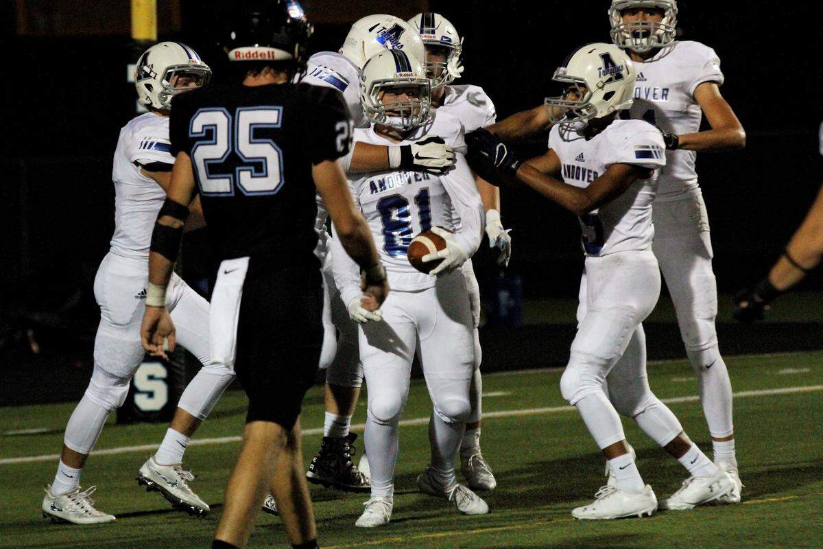 Andover sophomore receiver Max Smith celebrates with his teammates after scoring a touchdown in the Trojans’ 30-22 win over Goddard Eisenhower on Thursday night. (Sept. 13, 2018)