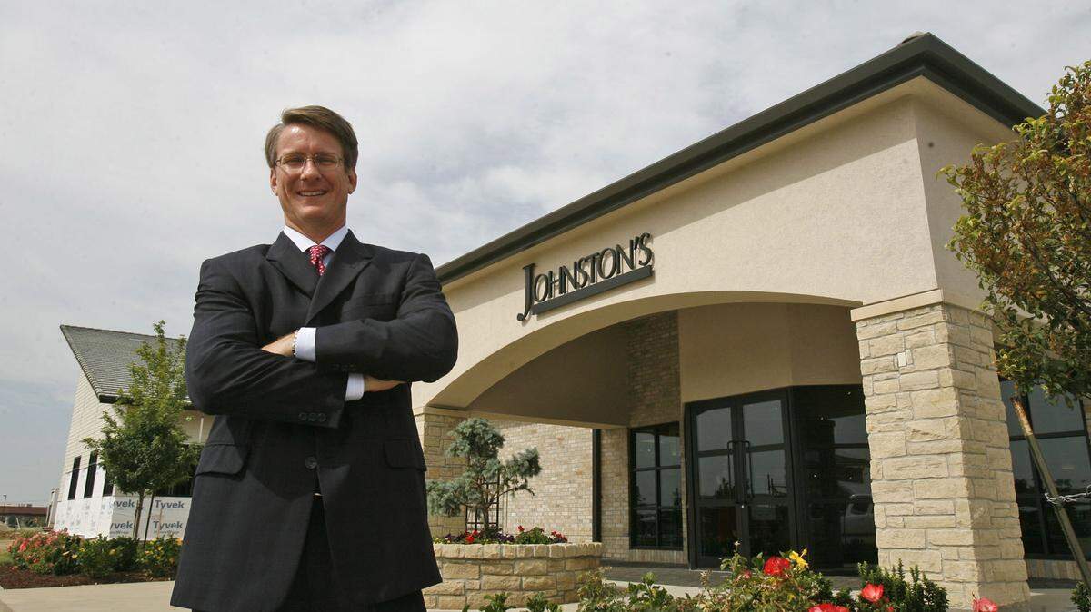 J.V. Johnston, who still is a co-owner in the Johnston’s clothing store, is leaving Newman University to become executive director of the Guadalupe Clinic.
