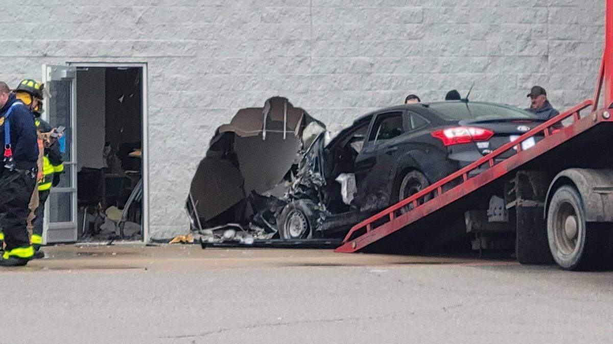 A woman was injured Friday when her car drove into the vision center at Walmart in Newton.