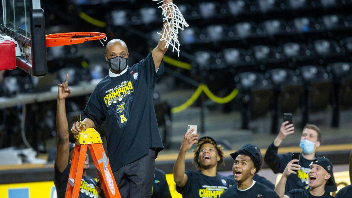 Wichita State men’s basketball head coach Isaac Brown celebrates the 2020-21 AAC championship won at Koch Arena.