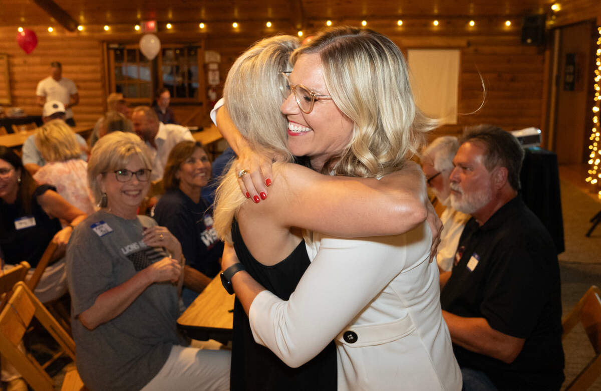 Stephanie Wise receives a hug after winning the Republican primary for Sedgwick County Commission District 3. Wise held a party at Eberly Farms.