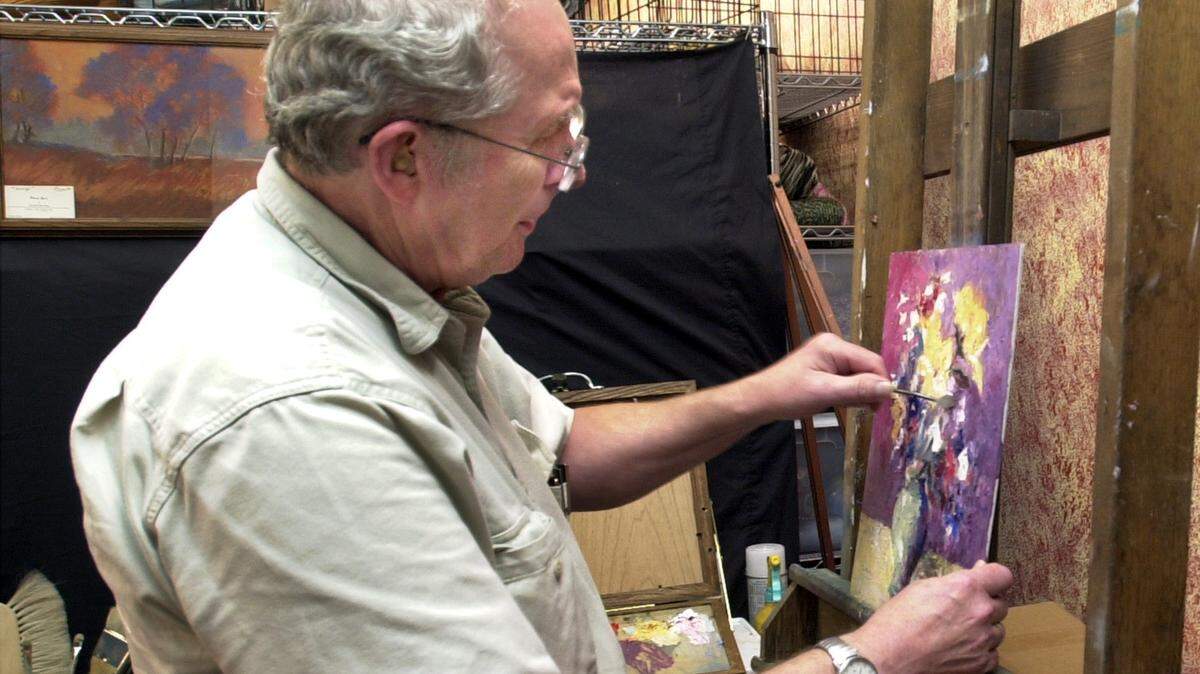 In this 2005 file photo, Curtis Newby works on a painting at Mead Street Gallery & Gifts. Dec. 31st will be the gallery’s last day in business. Newby says business has dropped off in the last year, and the five artists who operate the gallery are getting older.