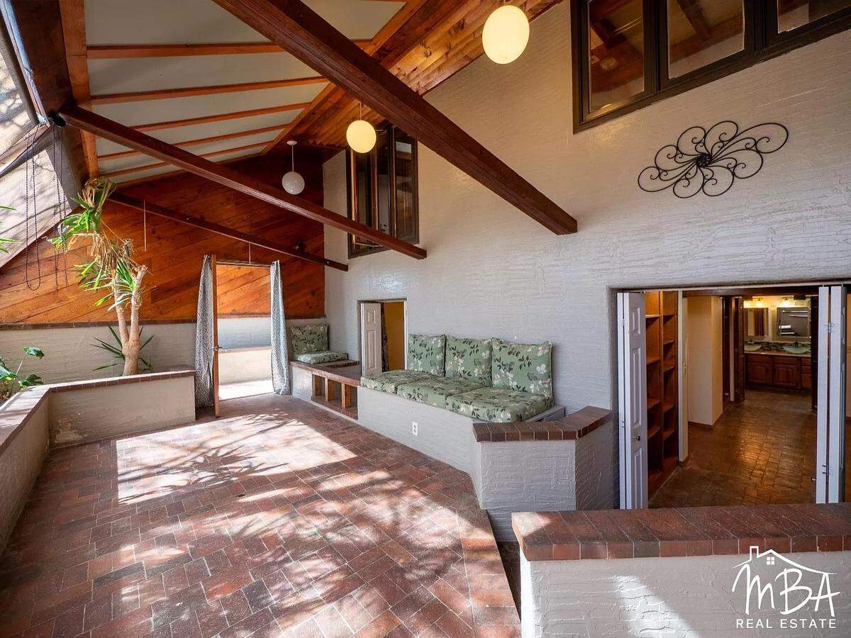 See inside the sunroom of this Garden City property for sale.