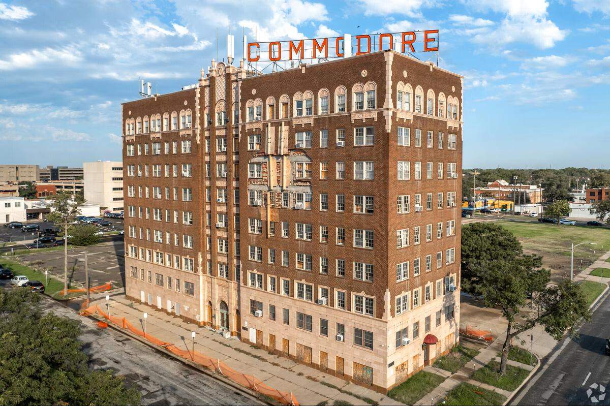 A recent photo of the Commodore on North Broadway, which shows some of the damage to its facade that happened earlier this year.