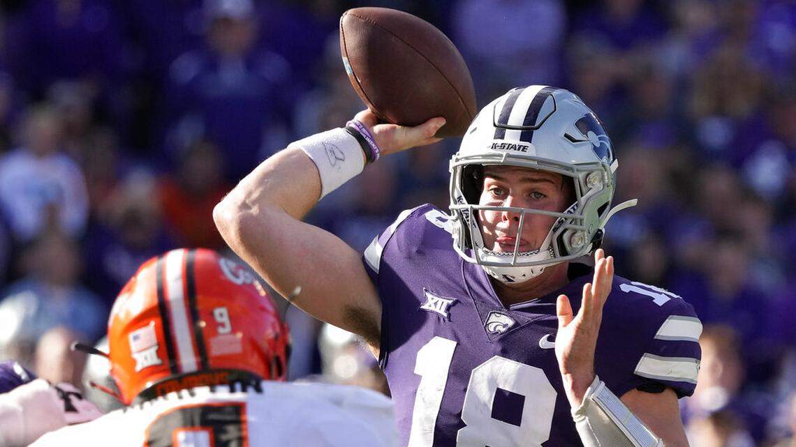 Kansas State quarterback Will Howard throws for a touchdown during the first half of an NCAA college football game against Oklahoma State Saturday, Oct. 29, 2022, in Manhattan, Kan. (AP Photo/Charlie Riedel)