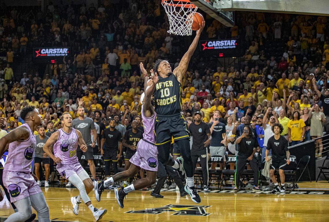 James Woodard goes in for the game-ending layup for the AfterShocks in their 74-67 win over Gutter Cat Gang on Wednesday at Koch Arena.