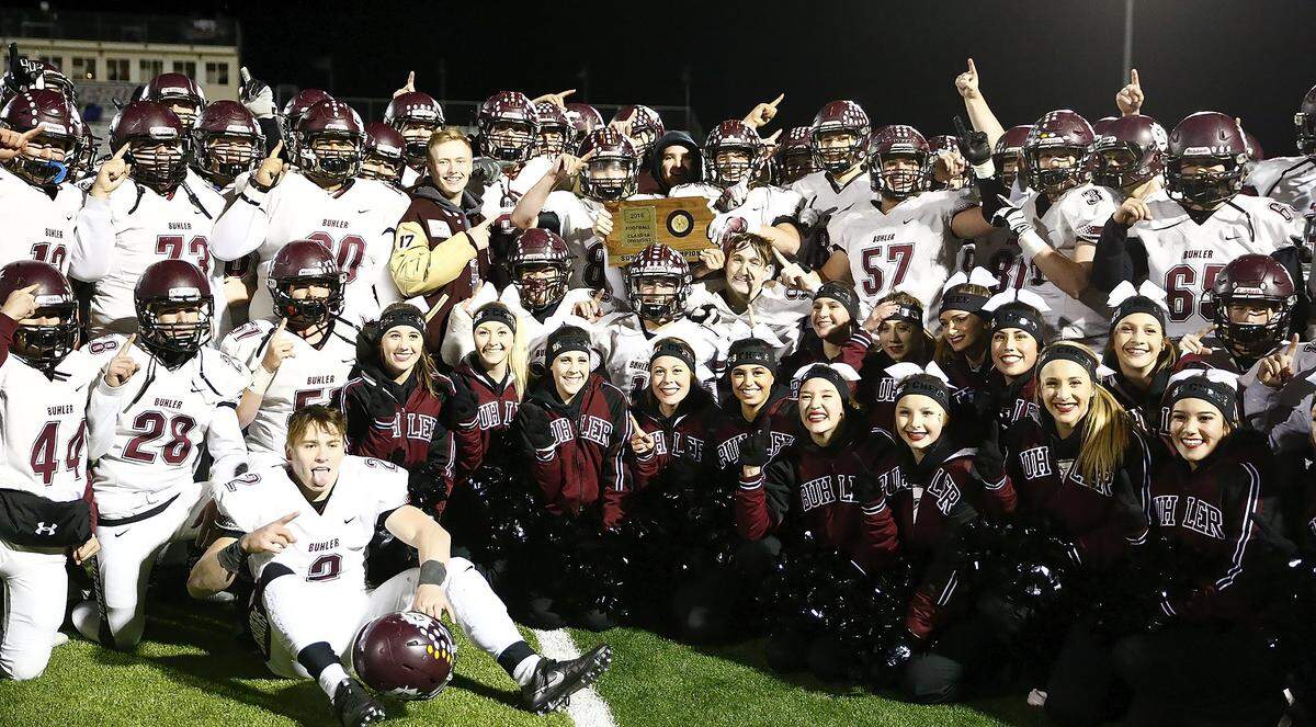 Buhler celebrates its 27-7 victory over Maize South.