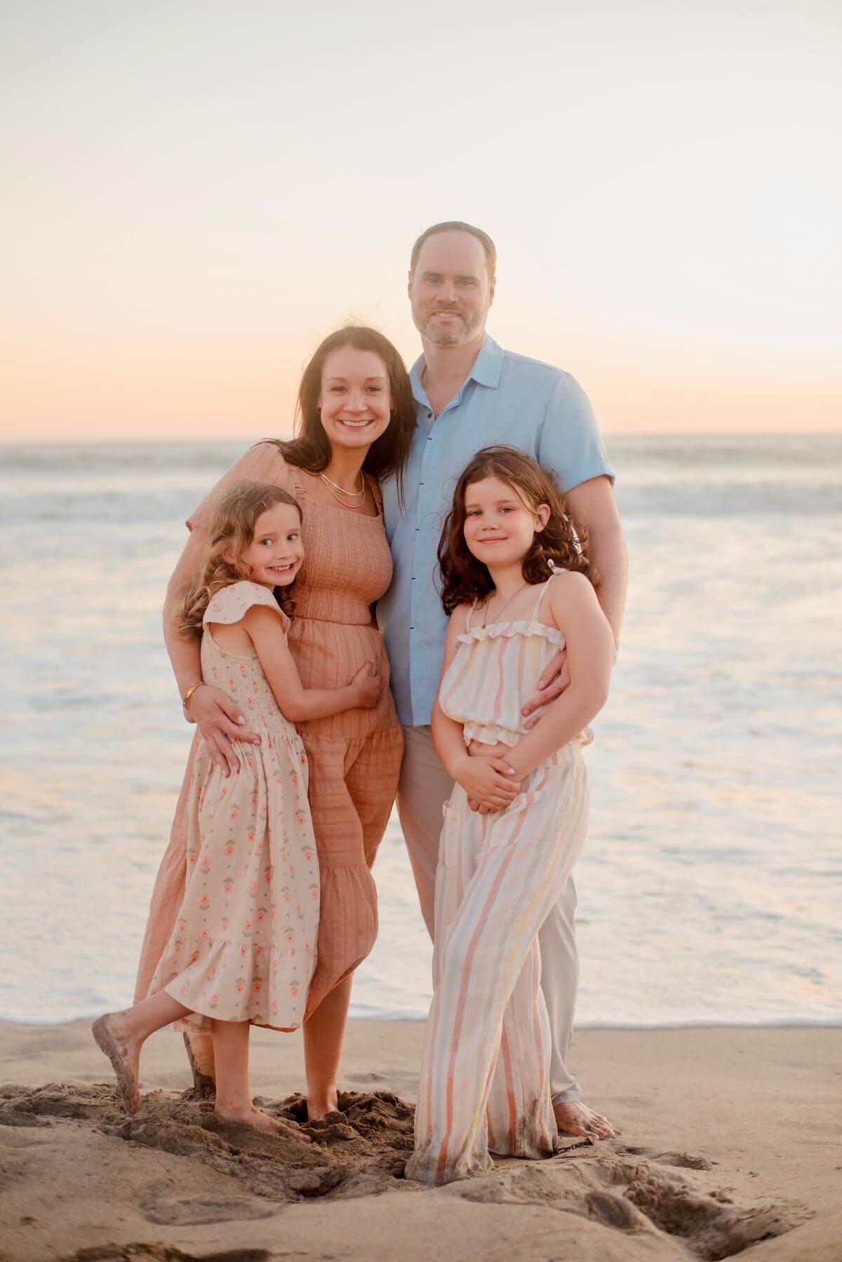 Keesha and Mike Ludlow with their daughters, from left, Eden, 6, and Ella, 8. Mike Ludlow changed careers in part to be able to spend more time with his daughters at their sports and events.