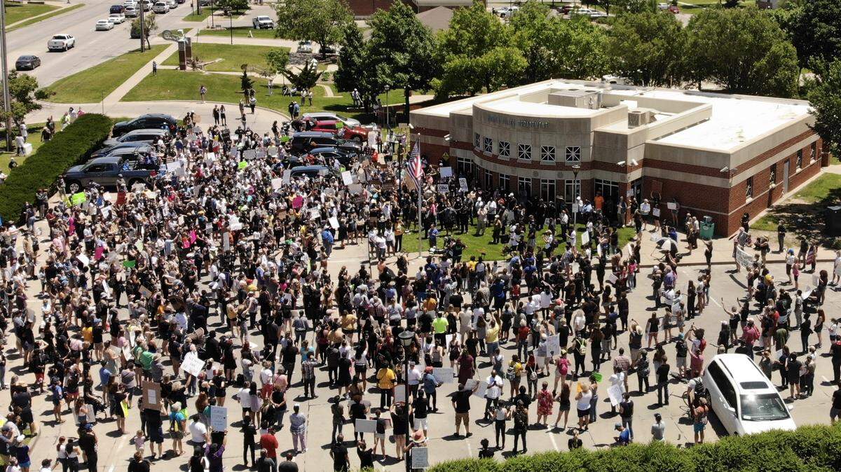 A large crowd gathered at Wichita Police North substation on East 21st Street on May 30, 2020 in a demonstration in favor of racial harmony and reconciliation. Wichita Police Chief Gordon Ramsay and City Council member Brandon Johnson were among the speakers.