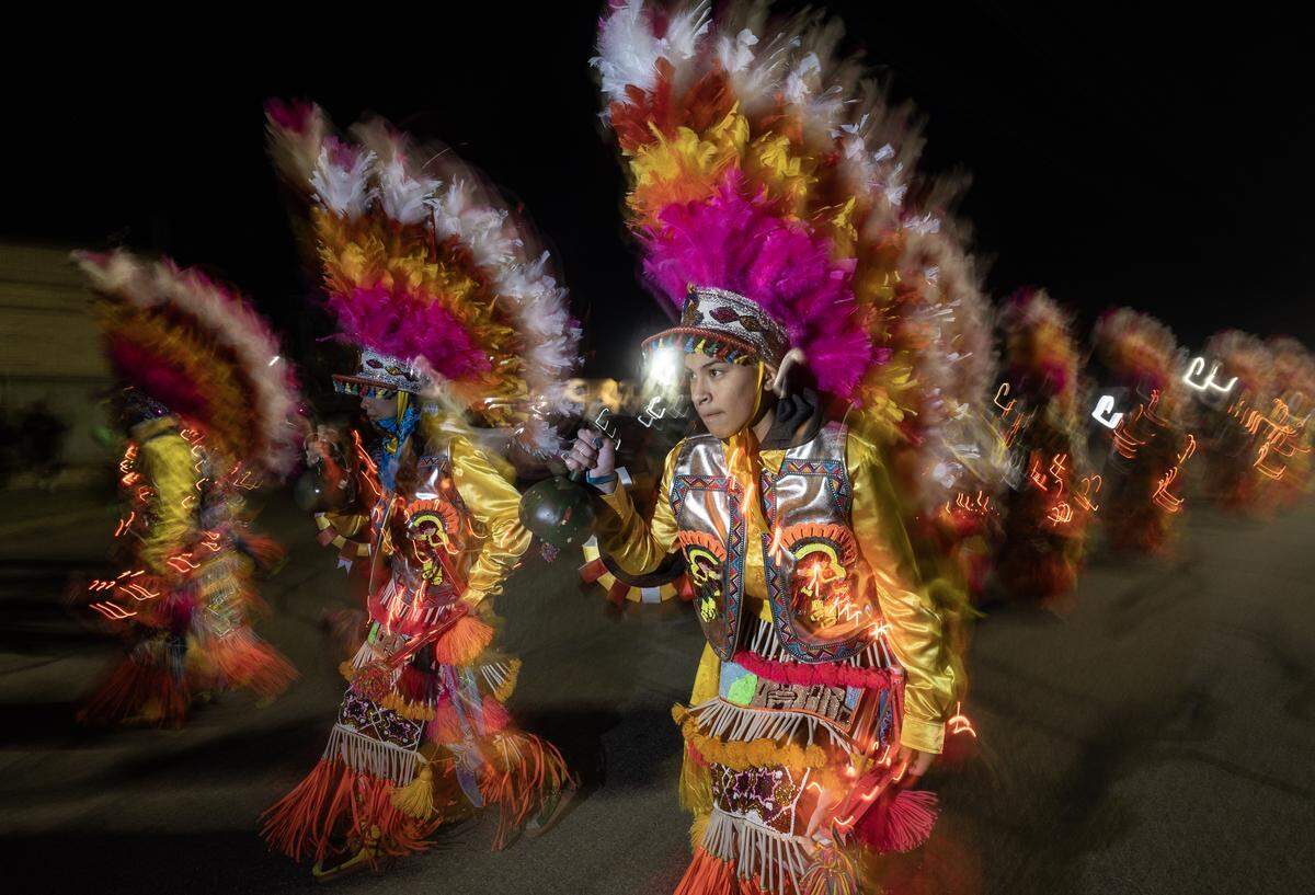 Dancers take part in a parade through north Wichita on Dec. 11 as part of the Virgin of Guadalupe Feast Day. The event commemorates an apparition of the Virgin Mary's before Mexican farmer Juan Diego in 1531.