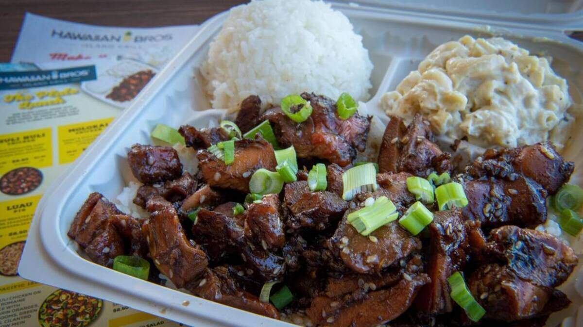 The Honolulu Chicken at Hawaiian Bros. is infused with garlic, green onions and sesame and served with macaroni salad and white rice.