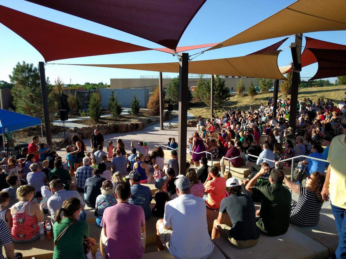A crowd awaits the start of the T-Rex Feeding Frenzy at the Field Station in Derby, Kan.