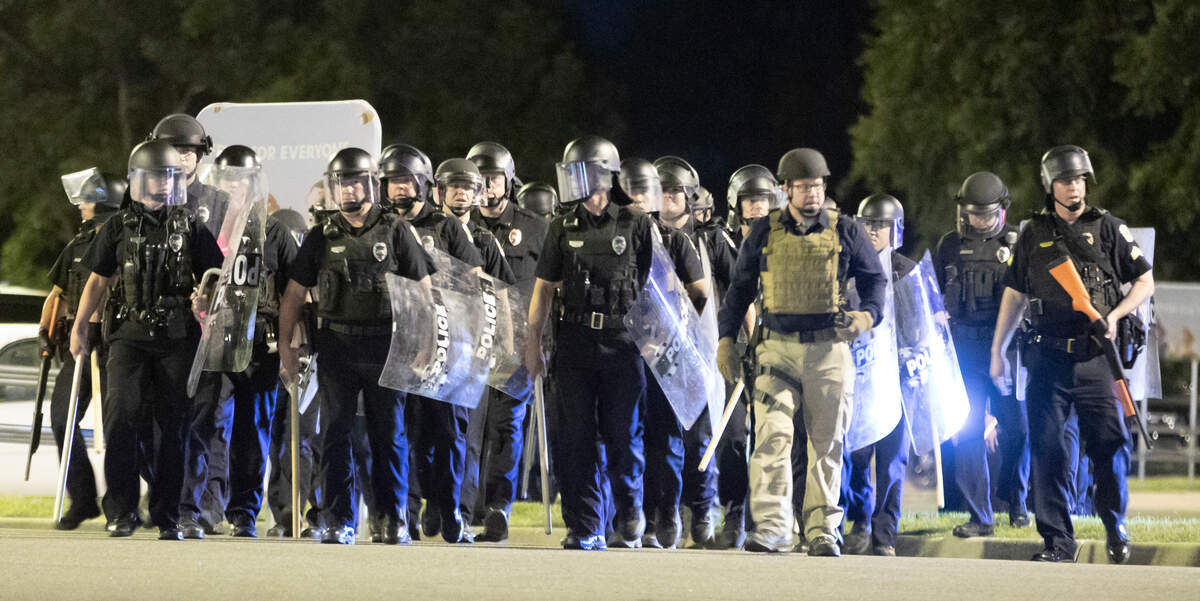 Police in riot gear prepare to remove protestors from an area around 21st and Maize in early June 2020.