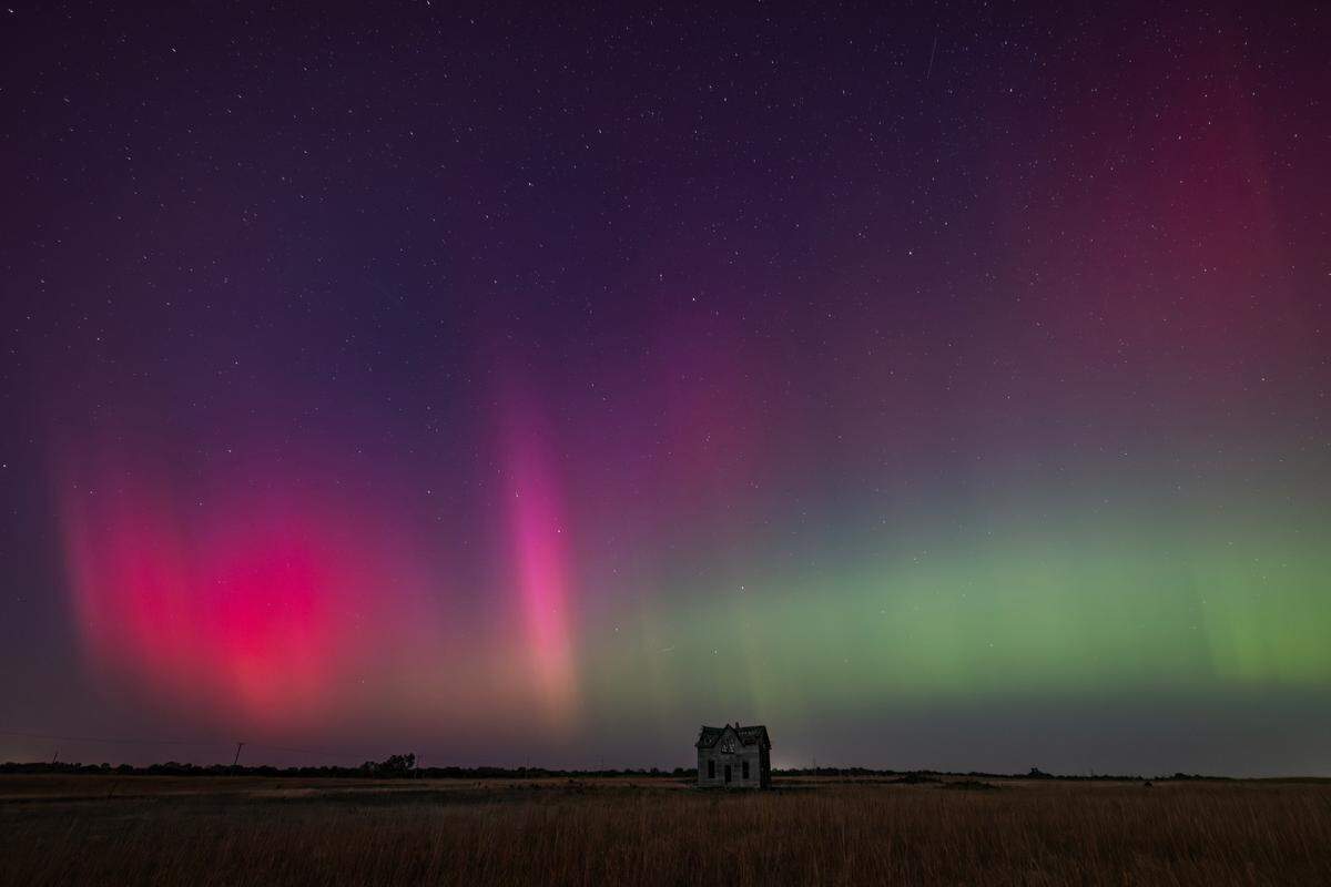 The northern lights can be seen above a dilapidated farmhouse near Marquette on Thursday night. The lights are caused by an interaction between the earth’s magnetic field and charged particles released by the sun.