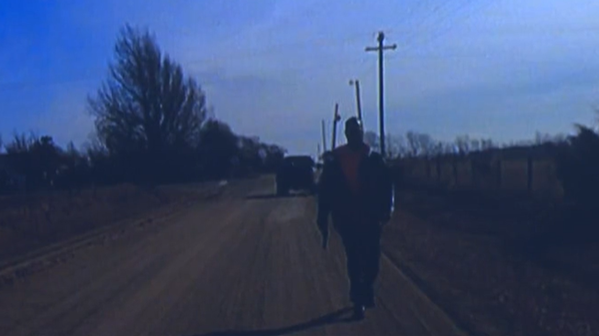 Michael Trask, seen here approaching a Goddard police officer’s vehicle with a gun, was fatally shot Monday after a car chase.