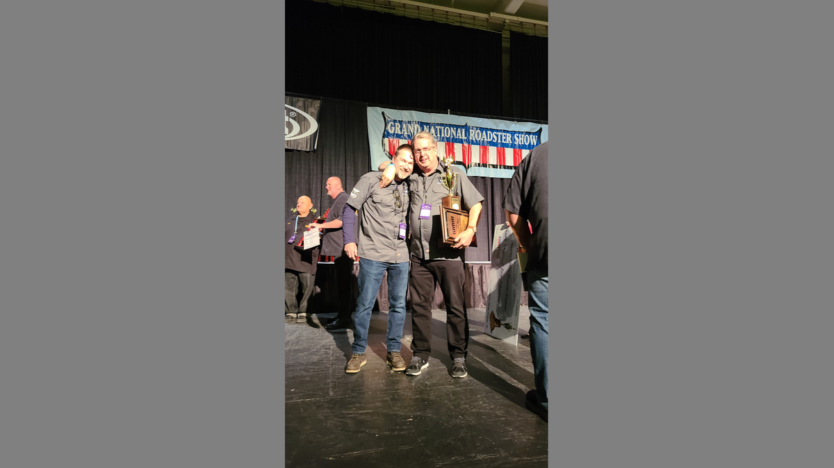 Tim Devlin, left, and Jeff Breault celebrate Breault’s 1934 Chevy Roadster being crowned America’s Most Beautiful Roadster at the Grand National Roadster Show on Sunday.