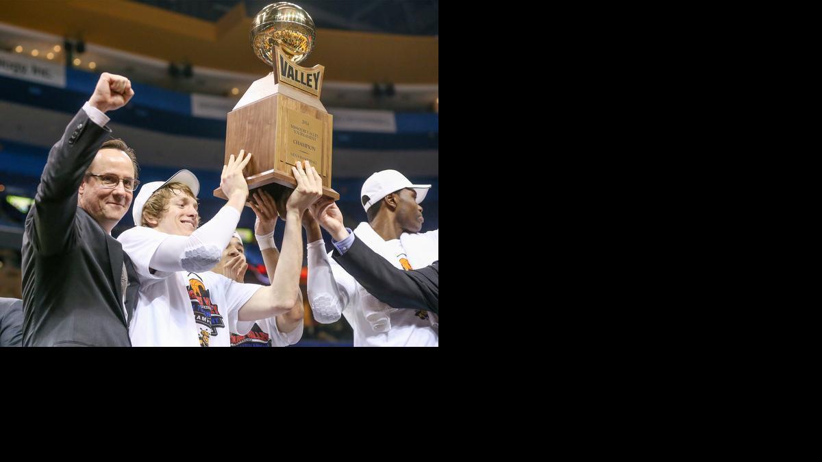 Wichita State coach Gregg Marshall raises his fist as his team holds up the championship trophy after winning the Missouri Valley Conference Tournament in St. Louis last Sunday.

