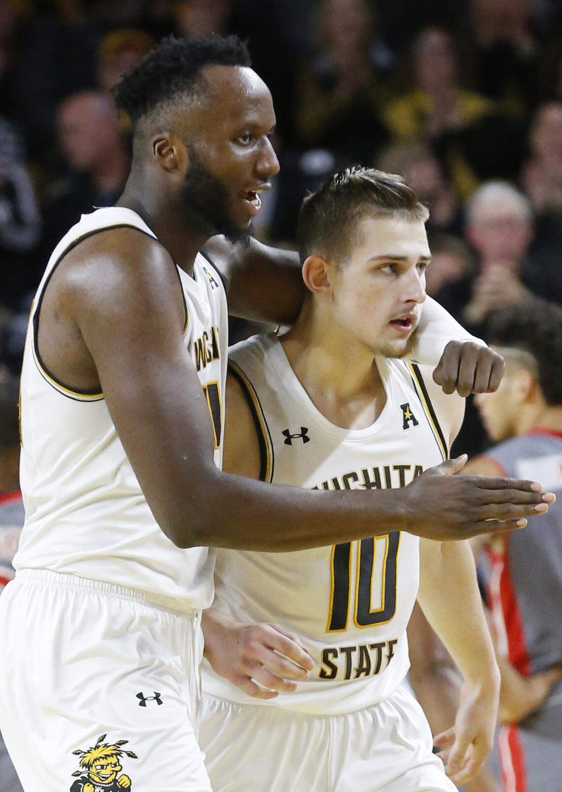 Wichita State’s Morris Udeze (24) hugs Erik Stevenson (10) after Stevenson dropped in a pair of 3 point shots in the second half against Gardner-Webb. (November 19, 2019)