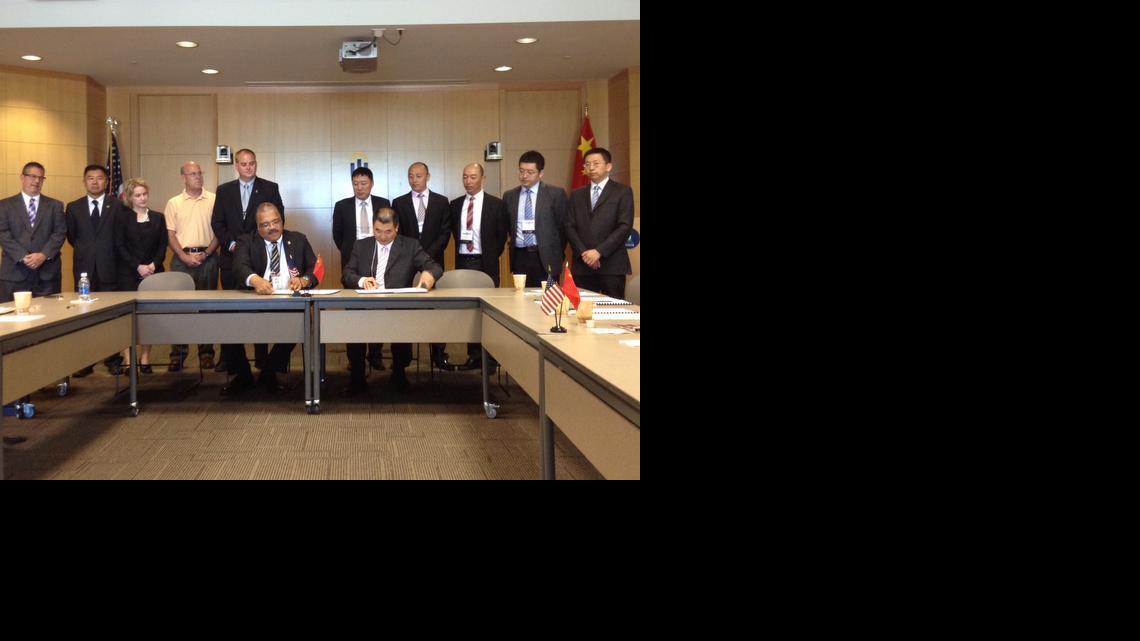 Delegates from Xi’an, China, visited with city officials Thursday to sign a memorandum of understanding that the two cities will develop economic and trade opportunities around aviation. Seated in the center are Mayor Carl Brewer and He Liang, director and researcher for Shaanxi Aviation Economic and Technological Development Zone.

