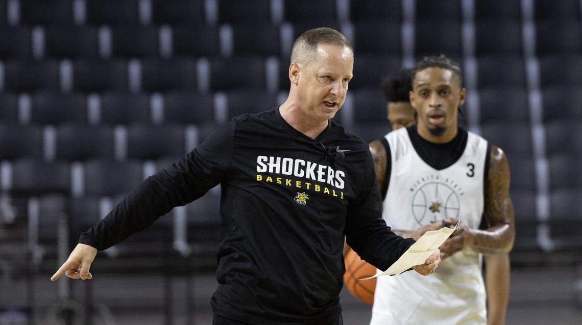 Wichita State men’s basketball coach Paul Mills instructs his team at a September practice at Koch Arena.