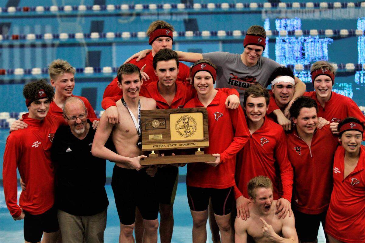 Wichita Heights hoists its third state championship trophy in five years at the 2019 Kansas high school swimming and diving meet in Topeka on Saturday. (Feb. 16, 2019)