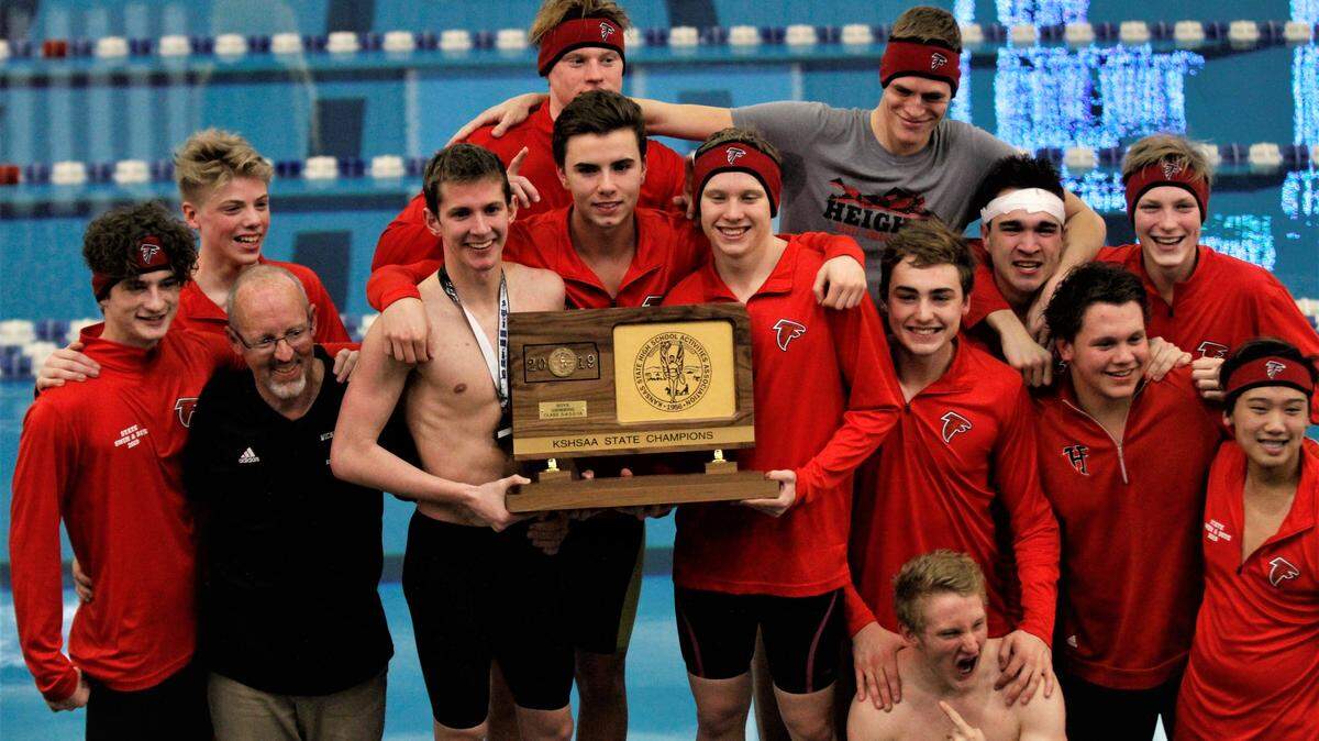 Wichita Heights hoists its third state championship trophy in five years at the 2019 Kansas high school swimming and diving meet in Topeka on Saturday. (Feb. 16, 2019)
