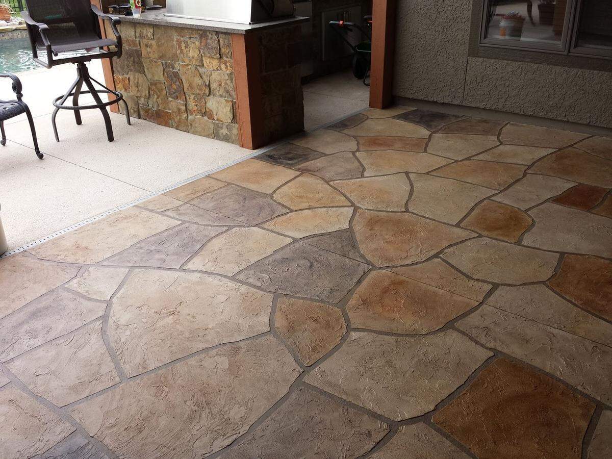 A natural flagstone look is one of the many varieties of concrete flooring that Sundek of Wichita offers.