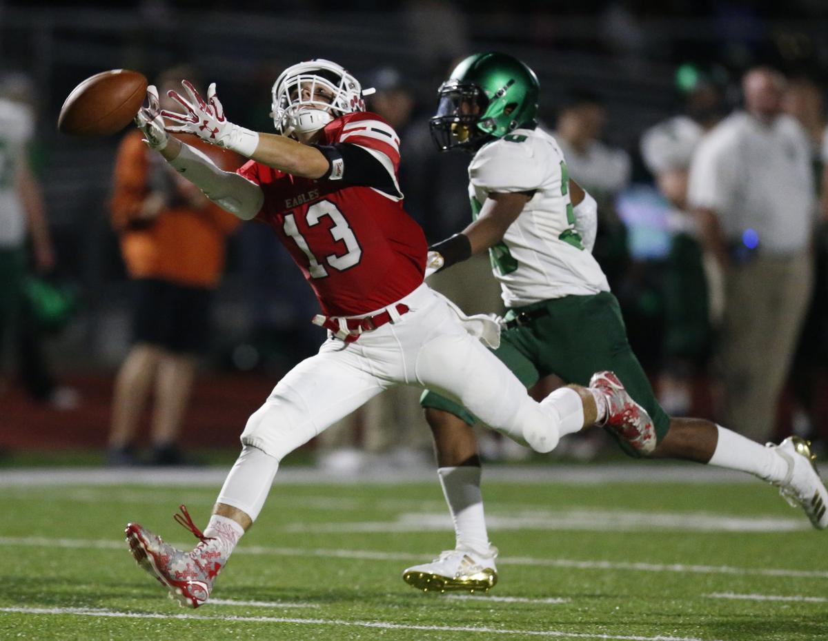 Maize wide receiver #13 Jordan Helm misses another overthrown pass Friday night against Derby. (October 19, 2018)